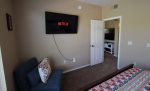 Guest bedroom offers a wall mounted Smart TV for streaming programs